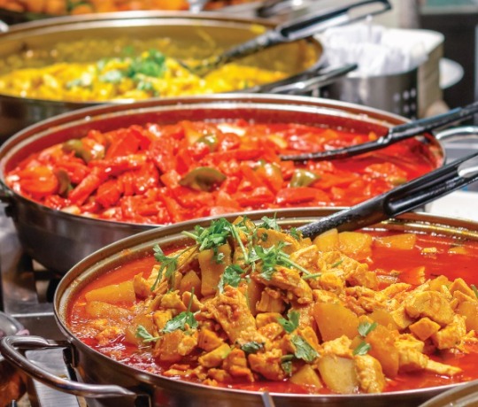 Mix of curry dishes being served